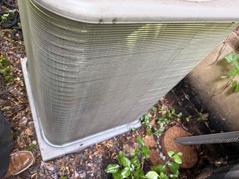 Completed comprehensive BFMA tune-up service on two residential Lennox air conditioning systems. Performed standard maintenance procedures including inspection of outdoor condensing units, cleaning of condenser coils showing dirt accumulation and environmental debris, verification of electrical connections at disconnect box, assessment of refrigerant levels, and testing of system operations. Both units operational and running within manufacturer specifications upon completion.