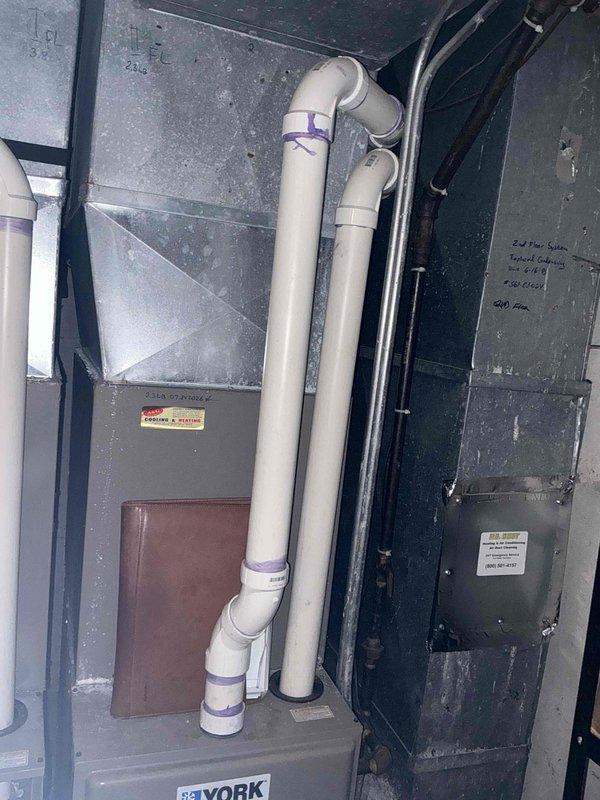 Completed comprehensive estimate for dual HVAC system replacement in residential property. Assessed existing basement installations including two York furnace and air conditioning units with current PVC venting configurations and condensate drainage systems. Evaluated ductwork, air handlers, and exhaust piping arrangements for both systems to determine replacement specifications and installation requirements for fall timeframe.