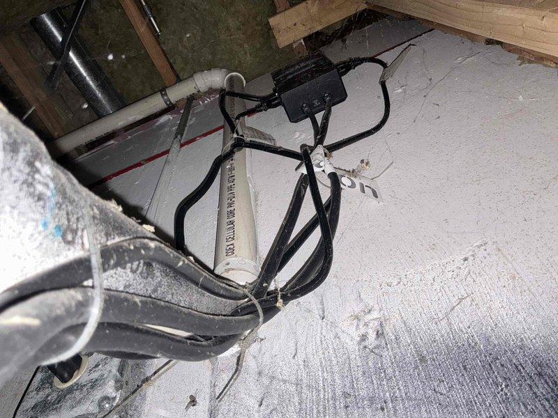Performed complimentary sump pump inspection and maintenance check in crawl space area. Accessed unit through insulated crawl space, navigating exposed joists, electrical wiring, and PVC drainage lines. Conducted visual assessment of pump operation, discharge piping, and surrounding mechanical systems to verify proper functionality and identify any maintenance concerns.