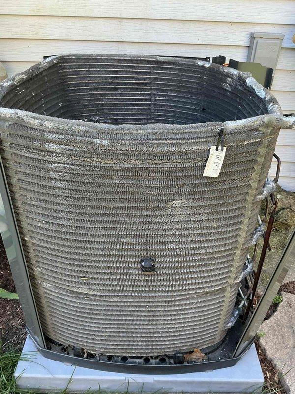 Completed BFMA preventive maintenance tune-up on outdoor air conditioning condenser unit. Removed top cover to access internal components and performed thorough inspection of condenser coil, which showed significant accumulation of dirt, dust, and debris throughout fin surfaces requiring cleaning. Inspected fan assembly, compressor, electrical connections, and structural mounting components to ensure proper operation and system integrity.