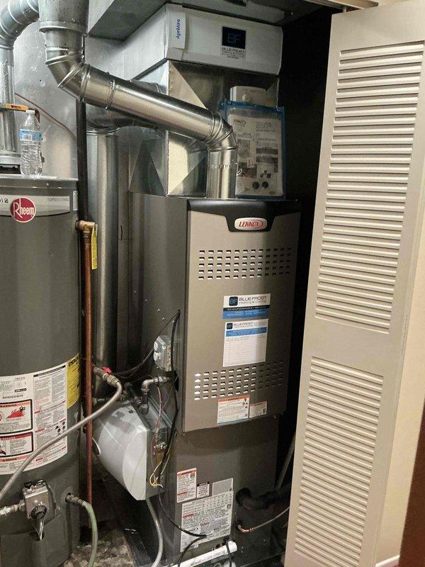 Completed full HVAC system installation including Lennox SL280DF090V downflow furnace, ML13KC1-030 outdoor condensing unit, matching evaporator coil, and Braeburn 2232 thermostat. System was installed in utility closet with proper ductwork connections, refrigerant line routing, and electrical hookups. Provided thorough thermostat operation instruction to ensure ease of use with simplified non-programmable settings as requested by family.