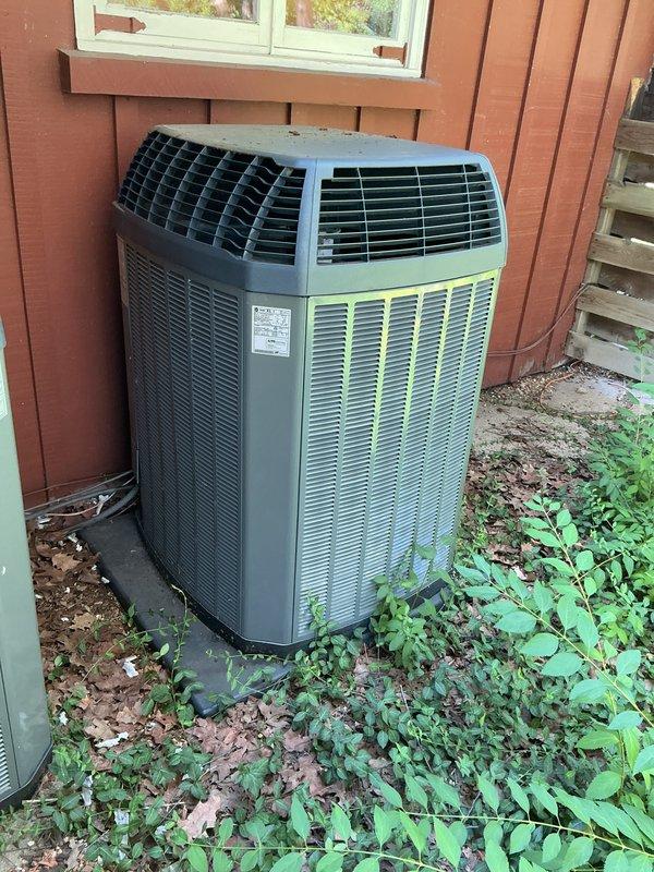 Completed comprehensive tune-up service on two Trane XL1 air conditioning systems, including a 2006 model 4TTX002A1000BA outdoor condensing unit. Performed standard maintenance protocols including inspection of electrical connections, refrigerant levels, condenser coil cleaning, fan motor operation verification, and overall system performance testing. Both units were found to be operating within manufacturer specifications, with minor vegetation growth noted around outdoor equipment that could affect airflow efficiency if left unaddressed.