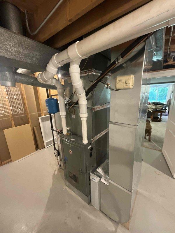 Completed comprehensive BFMA tune-up on residential split system with basement-mounted furnace and air handler. Performed full system inspection, verified operational parameters, cleaned condensate drain lines, checked refrigerant levels, tested thermostat functionality, and inspected ductwork connections. Documented equipment age and model information for new homeowner's service records, as system history was unknown at time of membership transfer.