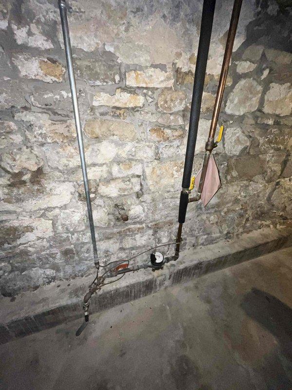 Completed comprehensive plumbing inspection of residential property as scheduled first-stop morning appointment. Conducted thorough visual assessment of basement plumbing infrastructure, including water supply lines, drainage systems, water heater installation, and water treatment equipment. Documented existing conditions with photographic records showing copper piping, utility connections, water filtration system, and overall mechanical room layout for maintenance records.