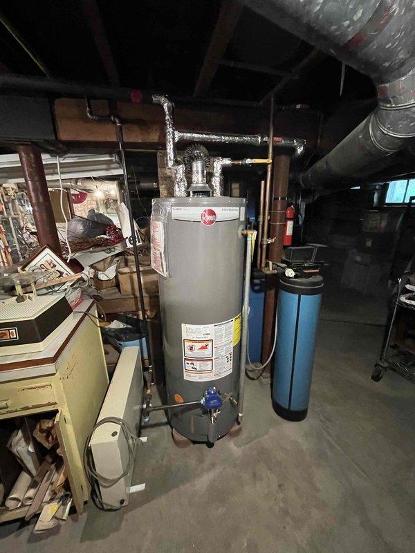 Completed comprehensive plumbing inspection of residential property as scheduled first-stop morning appointment. Conducted thorough visual assessment of basement plumbing infrastructure, including water supply lines, drainage systems, water heater installation, and water treatment equipment. Documented existing conditions with photographic records showing copper piping, utility connections, water filtration system, and overall mechanical room layout for maintenance records.