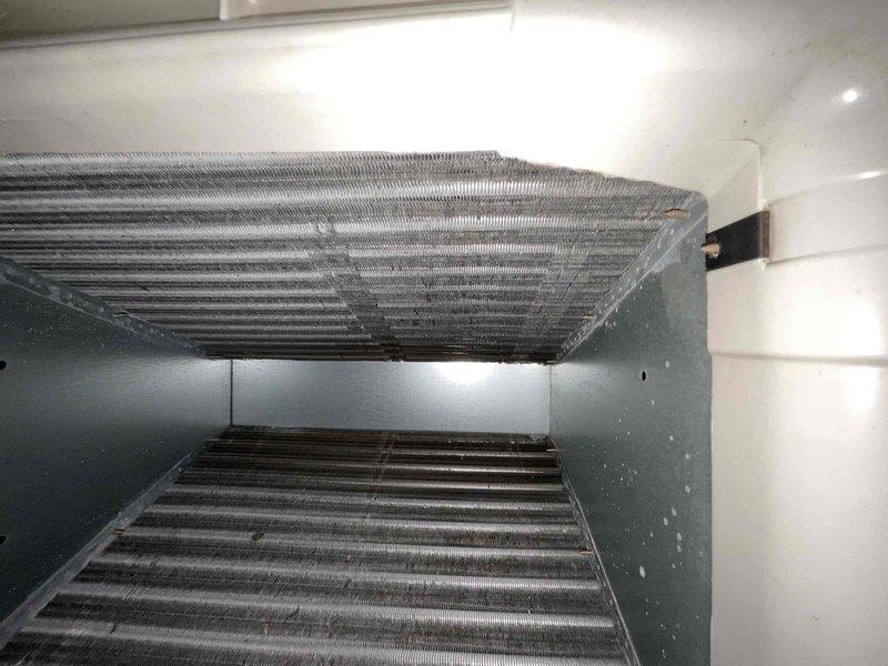 Completed comprehensive air conditioning tune-up on residential HVAC system aged 4+ years during morning service window. Performed thorough inspection of evaporator coil assembly, noting dust and debris accumulation on metallic fins, and replaced dirty air filter with new pleated media filter to restore proper airflow and system efficiency. All components inspected and system operating within normal parameters upon completion.