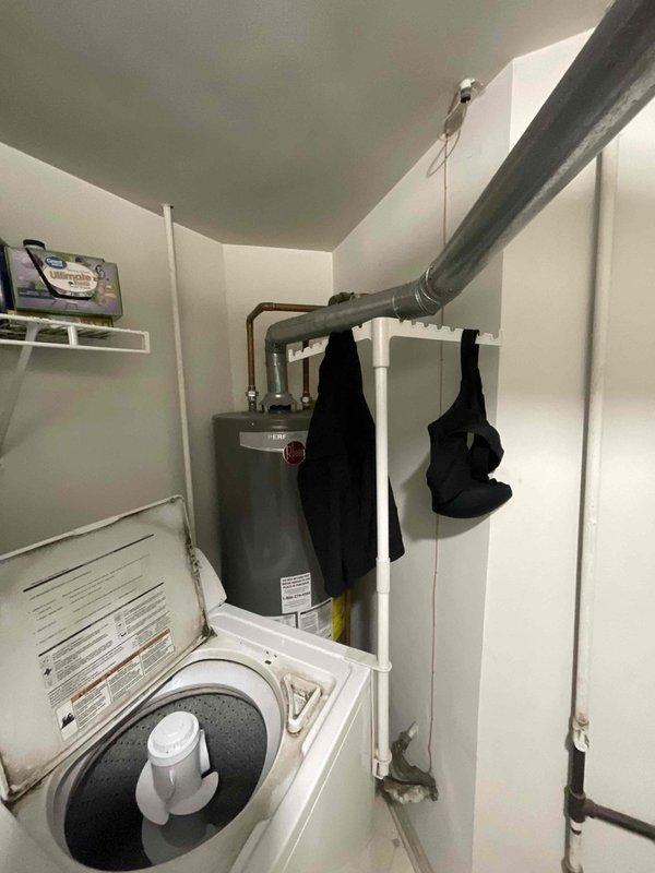 Completed on-site estimate for furnace replacement at residential property. Assessed existing HVAC system installation in utility closet, including beige air handler unit with insulated ductwork and flexible connectors. Documented current system configuration and mechanical room layout to provide accurate replacement recommendations and ensure proper sizing for new furnace installation.