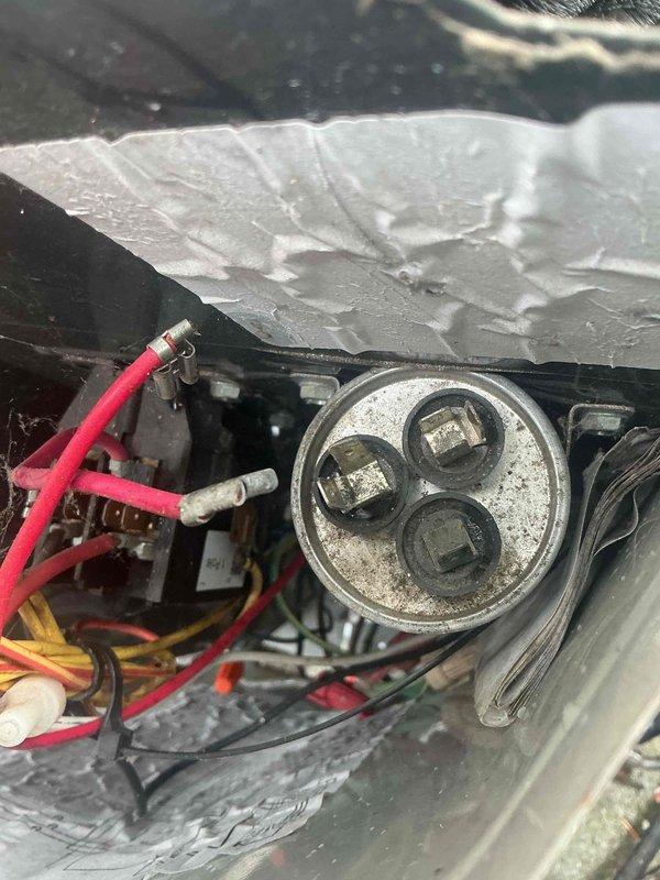 Completed comprehensive BFMA tune-up service on 12-year-old residential air conditioning system. Performed thorough inspection of outdoor condensing unit, including examination of dual-capacitor configuration with primary run capacitor and BoostCap hard start capacitor. Verified all electrical connections, tested capacitor functionality, and inspected wiring integrity throughout electrical compartment. Cleaned accessible components, checked refrigerant levels, and confirmed proper system operation. Unit tested and left in normal operating condition with all panels secured.