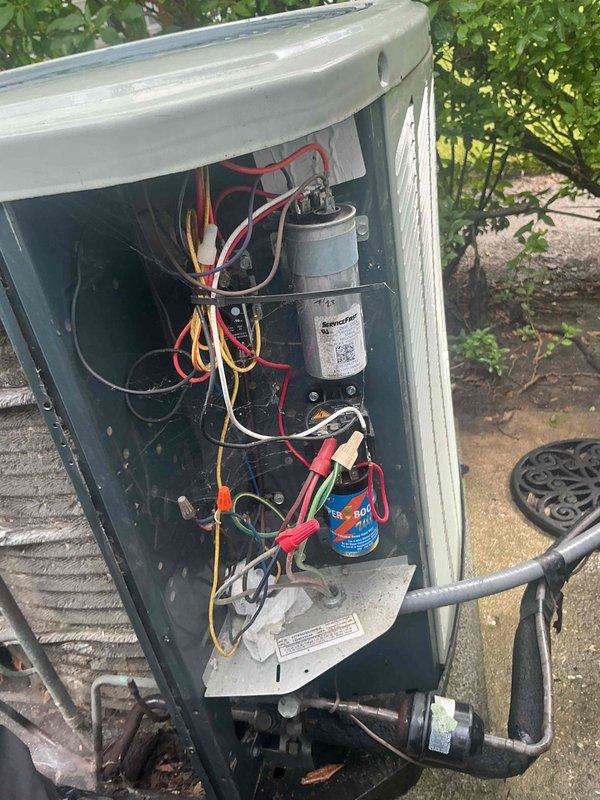 Completed comprehensive BFMA tune-up service on 12-year-old residential air conditioning system. Performed thorough inspection of outdoor condensing unit, including examination of dual-capacitor configuration with primary run capacitor and BoostCap hard start capacitor. Verified all electrical connections, tested capacitor functionality, and inspected wiring integrity throughout electrical compartment. Cleaned accessible components, checked refrigerant levels, and confirmed proper system operation. Unit tested and left in normal operating condition with all panels secured.