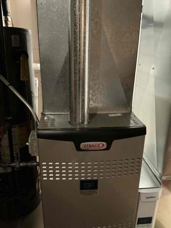 Conducted estimate assessment for complete HVAC system replacement on 14+ year old equipment following emergency service call to restore cooling operation. Evaluated existing outdoor condensing unit and indoor Lennox furnace with coil assembly, both showing significant age-related wear including oxidation on ductwork and general system degradation. Documented current equipment configuration and provided replacement options for matched A/C and coil system to address aging infrastructure and prevent future failure.