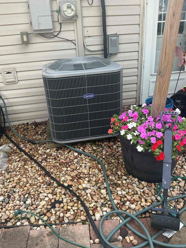 Completed comprehensive BFMA tune-up service on Carrier air conditioning system. Performed electrical diagnostics using digital multimeter to verify capacitor functionality and electrical connections, recording measurements within normal operating parameters. Conducted full system inspection of outdoor condenser unit, confirming proper operation of all components and documenting equipment condition through photographic records.