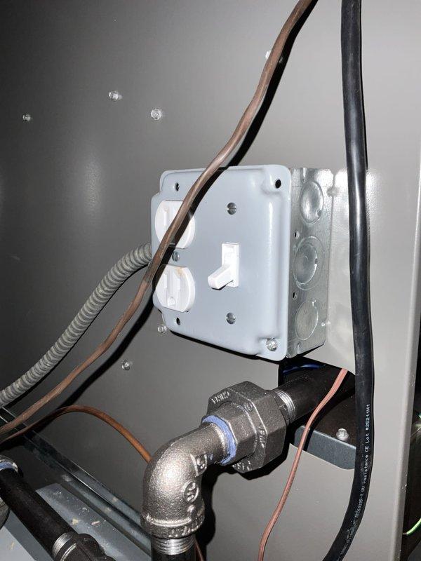 Responded to no cooling call at residential property where outdoor unit failed to operate while indoor fan continued running. Upon arrival, found indoor temperature had reached 84°F. Performed diagnostic testing on outdoor unit using clamp meter and multimeter to check electrical supply and component operation. Inspected disconnect switch mounted on exterior wall, which was found in off position. Verified proper voltage supply at disconnect and traced electrical connections through conduit to unit. Checked refrigerant line connections and service valves for any obvious issues. Restored power at disconnect switch and verified outdoor unit operation. System returned to normal cooling operation with compressor and condenser fan running properly. Advised occupant regarding proper thermostat operation and importance of maintaining disconnect switch in on position for continuous system operation.