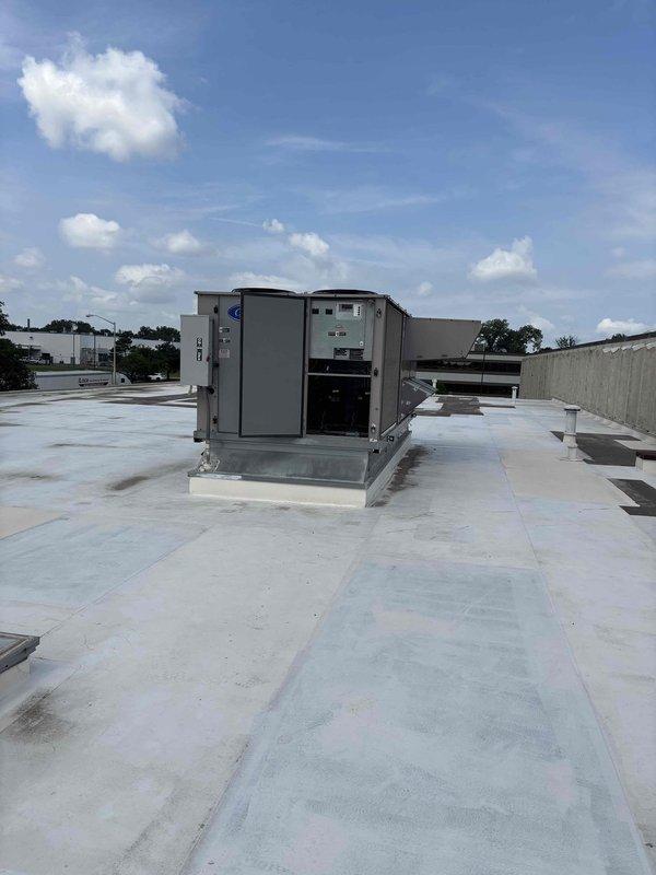 Replaced failed blower motor on commercial rooftop HVAC unit. Accessed unit via roof ladder, removed defective motor assembly, installed replacement motor, and verified proper operation. Equipment staged at headquarters prior to service call completion.