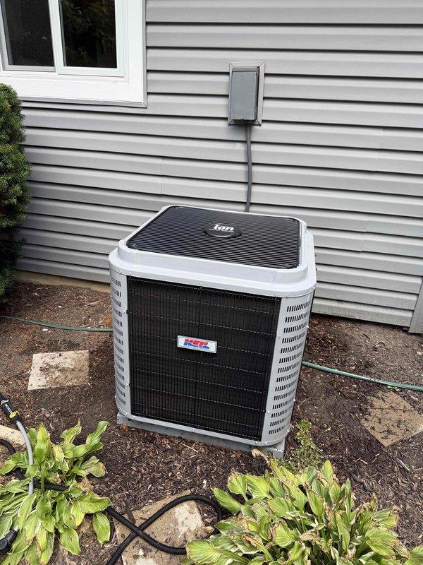 Completed comprehensive BFMA tune-up on Heil air conditioning system located on exterior concrete pad. Performed standard preventative maintenance inspection including electrical disconnect evaluation, which showed significant weathering and rust staining requiring monitoring for future replacement consideration. Unit operational with all components functioning within normal parameters upon completion of service.