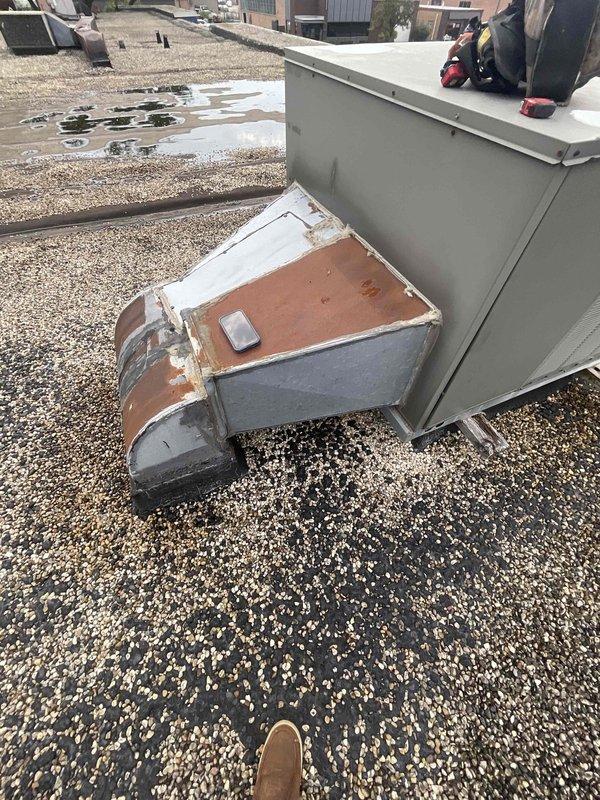 Conducted site assessment for rooftop unit replacement on commercial facility. Inspected existing RTU installation showing significant weathering and corrosion, documented electrical panel configuration and rooftop conditions, and provided estimate for complete unit replacement.