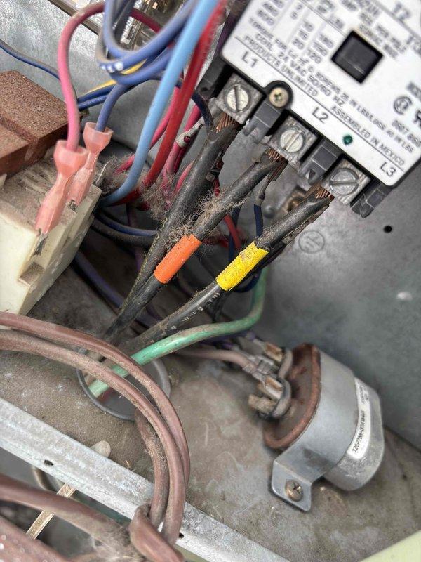 Replaced failed condenser fan motor and capacitor on commercial HVAC unit. Upon inspection, equipment showed significant dust and debris accumulation on electrical connections and components, along with visible corrosion on terminals. Successfully installed new motor and capacitor, restoring proper unit operation.