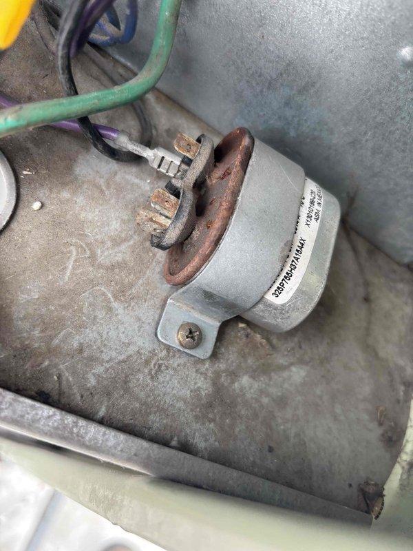 Replaced failed condenser fan motor and capacitor on commercial HVAC unit. Upon inspection, equipment showed significant dust and debris accumulation on electrical connections and components, along with visible corrosion on terminals. Successfully installed new motor and capacitor, restoring proper unit operation.