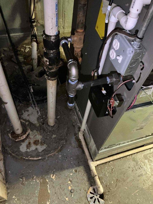 Responded to service call for furnace repair with parts staged at headquarters. Upon arrival, inspected HVAC system and identified damaged components requiring replacement on the air handler unit. Replaced faulty condensate pump assembly mounted on the front of the unit, ensuring proper electrical connections with new wiring. Addressed corroded piping and fittings in the condensate drainage system, replacing deteriorated sections to prevent future leaks. Installed new PVC drain lines and verified proper trap configuration for condensate removal. Tested all electrical connections at the junction box and confirmed proper pump operation. Cleared debris from work area and verified system functionality. All replaced components are now operating within manufacturer specifications, and condensate drainage system is functioning properly without leaks or blockages.