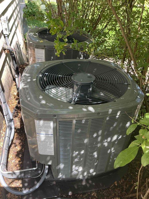 Responded to no cooling complaint on 1-2 year old residential air conditioning system experiencing intermittent cooling issues. Upon inspection, found outdoor condenser coil heavily obstructed with dirt, dust, and debris accumulation, significantly restricting airflow and reducing heat transfer efficiency. Removed outer casing to expose cylindrical condenser coil, which displayed thick layer of organic matter and particulate buildup across entire surface area. Performed thorough coil cleaning to restore proper airflow and system performance, addressing the root cause of intermittent cooling operation.