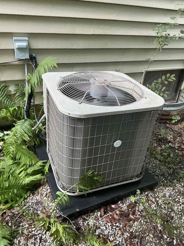 Completed comprehensive air conditioning tune-up on a 7-year-old system per customer request for afternoon service. Performed standard maintenance protocol including inspection of outdoor condenser unit, verification of proper airflow through metal mesh grille and fan operation, and replacement of dirty air filter which showed significant dust accumulation. All components found operating within normal parameters with no issues identified during inspection.