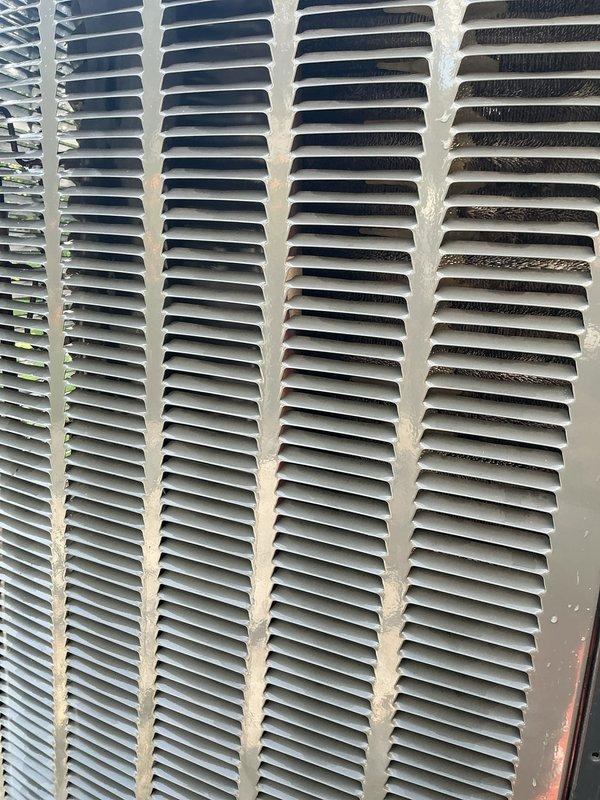 Completed comprehensive AC tune-up on 7+ year old system, including inspection of all major components, cleaning of condenser coils which showed moderate debris accumulation, and replacement of air filter. Provided thermostat operation instruction and troubleshooting assistance to address customer's difficulty with temperature control settings, ensuring proper understanding of system controls before departure.