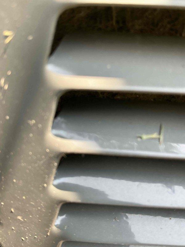 Responded to after-hours emergency call for non-cooling air conditioning system on approximately 60-year-old unit. Performed diagnostic evaluation of system components, documented equipment condition with photographs showing aged compressor assembly with weathered exterior casing and connected refrigerant lines, and measured electrical parameters using clamp meter which indicated no current draw, suggesting compressor failure or electrical disconnect.
