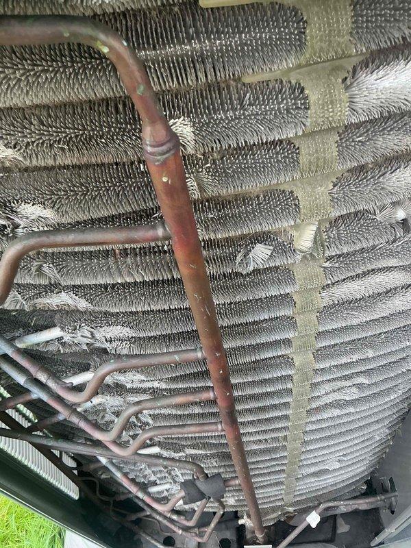 Completed comprehensive BFMA tune-up on 6-year-old air conditioning system. Performed full inspection of evaporator coil, noting moderate oxidation on refrigerant lines and minor debris accumulation between cooling fins. Serviced UV light filtration component, inspected all accessible copper refrigerant piping, and verified system operational status. All equipment functioning within normal parameters at time of service completion.