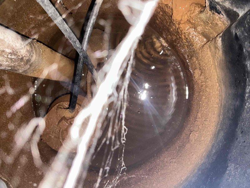 Completed comprehensive sump pump inspection per client's request for morning service appointment. Inspected sump basin interior condition, noting age-related wear and discoloration on walls, verified pump functionality and discharge system components, and documented all mechanical equipment and mounting hardware. System operational with no immediate repairs required at time of inspection.