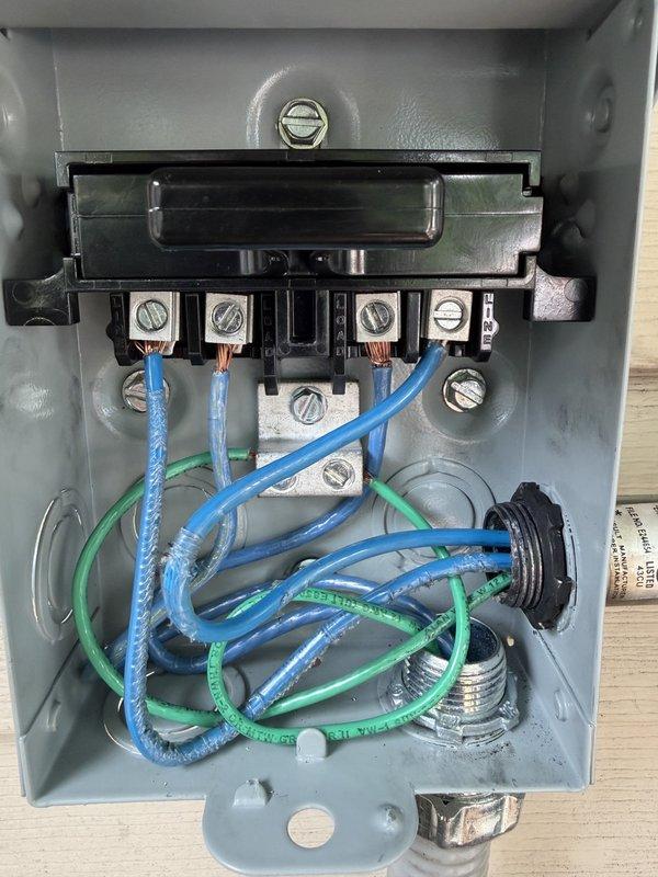 Responded to callback for outdoor condensing unit positioned too close to electrical meter in violation of code requirements. Pumped down refrigerant from MUZ-FX15NLHZ outdoor unit and relocated condenser, rotating 90 degrees perpendicular to house to achieve minimum 3-foot clearance from meter and adequate service access on all sides. Verified electrical installation was complete with proper 20A2P breaker and conduit routing, then recharged system and performed full startup procedures on Mitsubishi mini-split hyper heat system serving sunroom.