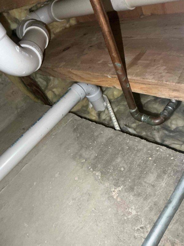 Completed complimentary sump pump inspection of residential property. Upon thorough examination of crawlspace and basement areas, inspected all accessible plumbing systems including PVC drainage lines, copper water supply lines, and verified proper installation of dual water heater system with associated piping and condensate pump equipment. All components found to be in satisfactory working condition with no immediate service requirements identified.