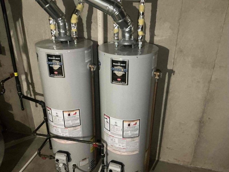 Completed complimentary sump pump inspection of residential property. Upon thorough examination of crawlspace and basement areas, inspected all accessible plumbing systems including PVC drainage lines, copper water supply lines, and verified proper installation of dual water heater system with associated piping and condensate pump equipment. All components found to be in satisfactory working condition with no immediate service requirements identified.