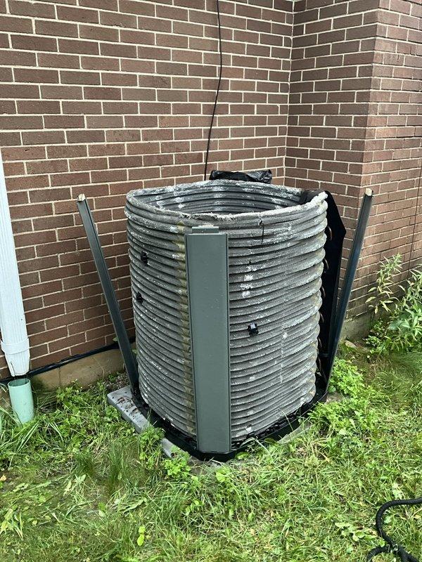 Completed comprehensive BFMA tune-up on 8-year-old residential HVAC system including air conditioning service and semi-annual filter cleaning. Inspected and serviced indoor blower assembly, confirming clean blower wheel and proper operation with no debris accumulation. Performed outdoor condenser unit inspection and maintenance, verifying proper operation of cylindrical coil configuration and clearing vegetation from equipment perimeter to ensure adequate airflow and system efficiency.