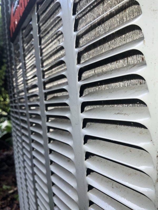 Completed comprehensive BFMA tune-up service on two Amana outdoor condenser units, both approximately 10 years old. Performed standard preventive maintenance protocol including inspection of condenser coils, louvers, and exterior housing; verified proper operation of both systems with no issues found. Cleaned debris from unit tops and surrounding area, confirmed all components functioning within normal parameters.