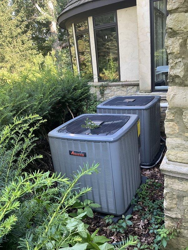 Completed comprehensive BFMA tune-up service on two Amana outdoor condenser units, both approximately 10 years old. Performed standard preventive maintenance protocol including inspection of condenser coils, louvers, and exterior housing; verified proper operation of both systems with no issues found. Cleaned debris from unit tops and surrounding area, confirmed all components functioning within normal parameters.