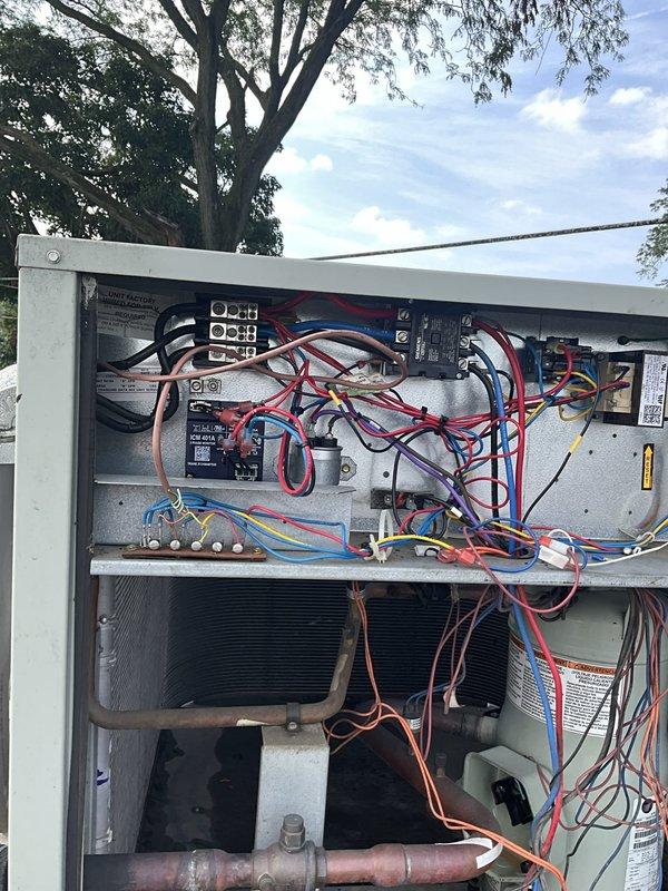 Responded to service call for split system air conditioning unit with no cooling condition following storm damage. Upon arrival, found outdoor unit with fan motor operating but system not producing cool air as reported by previous electrician. Performed comprehensive diagnostic inspection of outdoor condensing unit, examining electrical components, contactors, circuit breakers, and control wiring. Inspected refrigerant lines, heat exchanger coil, and all mechanical components for storm-related damage. Additionally conducted safety inspection of indoor heating system per customer request due to gas service disconnection by utility company following suspected gas leak. All findings documented photographically showing exterior cabinet condition, internal electrical components, wiring connections, and overall system configuration for insurance documentation purposes related to storm damage claim.