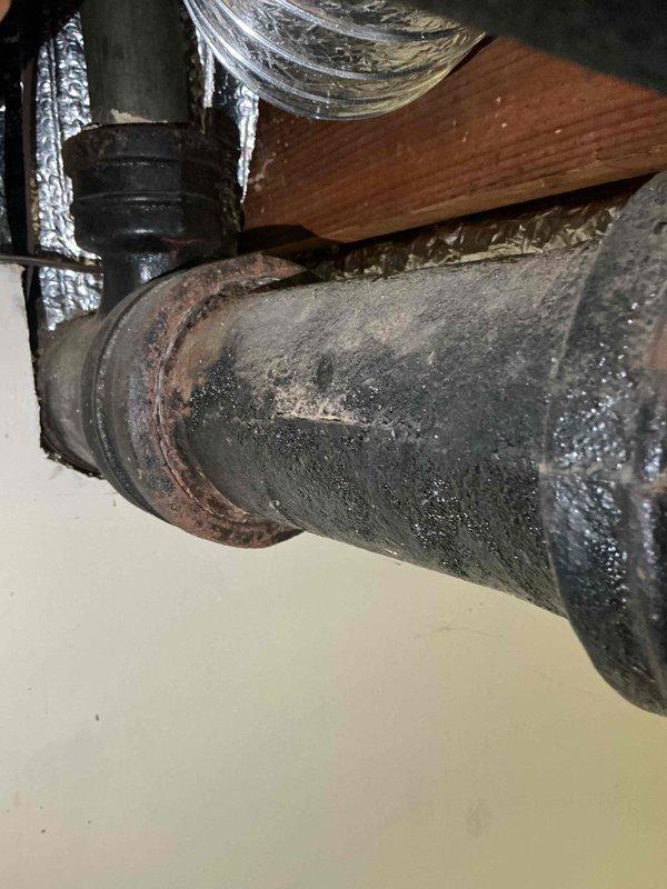 Completed comprehensive sump pump system inspection and maintenance in morning service call. Serviced backup battery system with QS12-120 battery unit, verified electrical connections and power supply functionality, and inspected associated plumbing infrastructure including discharge piping which showed signs of corrosion and age-related deterioration requiring monitoring for future replacement consideration.