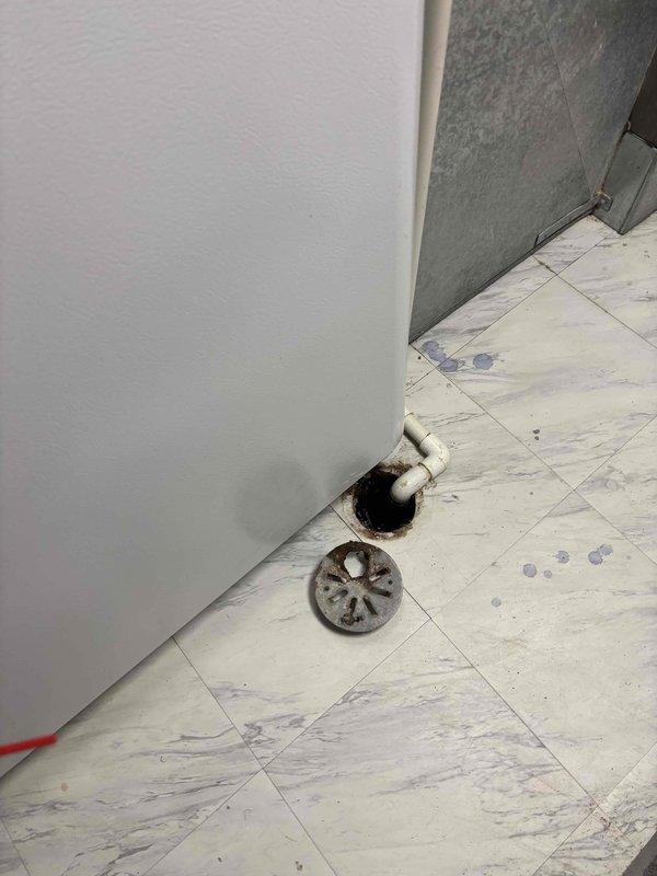 Responded to water leak complaint at residential HVAC system. Upon inspection, identified severely corroded PVC condensate drain fitting at furnace unit causing water discharge onto floor. Removed deteriorated drain components showing extensive rust and corrosion buildup that compromised drainage integrity. Replaced failed PVC drain fitting and associated hardware to restore proper condensate removal and eliminate active leak condition.