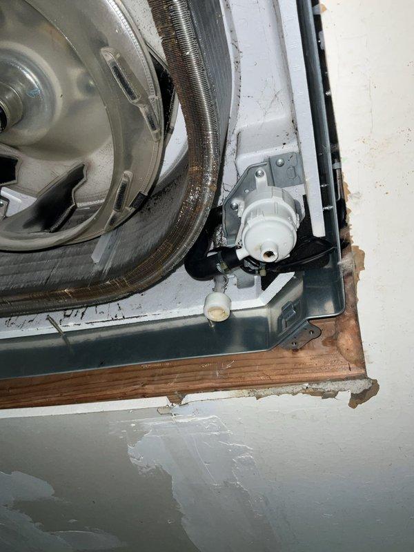 Responded to service call for multiple mini split wall units displaying blinking error codes in utility room and adjacent room following breaker reset. Inspected ceiling-mounted cassette unit to diagnose condensate drainage system issues, specifically examining pump and float switch operation. Due to limited access and tight installation constraints within the cassette housing, was unable to fully remove lower pan assembly to complete pump and float inspection during this visit. Documented installation conditions including flexible ductwork connections, condensate drain line configuration, and blower assembly mounting. Return visit scheduled with additional technician to facilitate complete cassette disassembly and thorough evaluation of drainage components to resolve error codes and restore normal system operation.