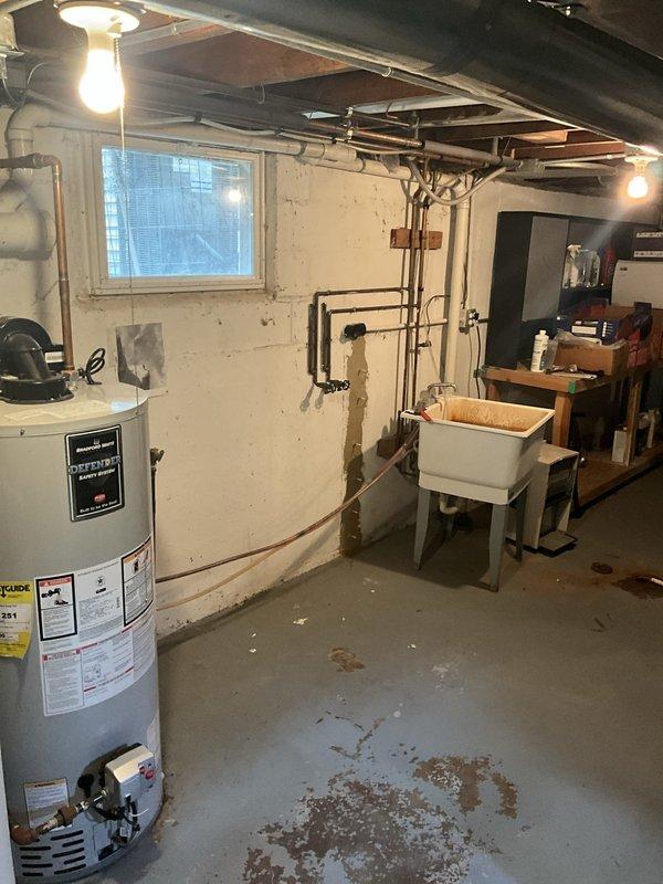 Responded to water softener malfunction causing basement flooding. Upon arrival, found iron breaker system experiencing backflow issues during regeneration cycle, resulting in water overflow from utility sink onto basement floor. Inspected plumbing connections, water softener regeneration valve, and drain line system. Identified blockage in drain line preventing proper discharge during regeneration cycle. Cleared obstruction from drain line, tested regeneration cycle to verify proper water flow and drainage. Confirmed utility sink no longer overflowing and water softener operating correctly. Cleaned affected area and advised on preventive maintenance for water softener system.
