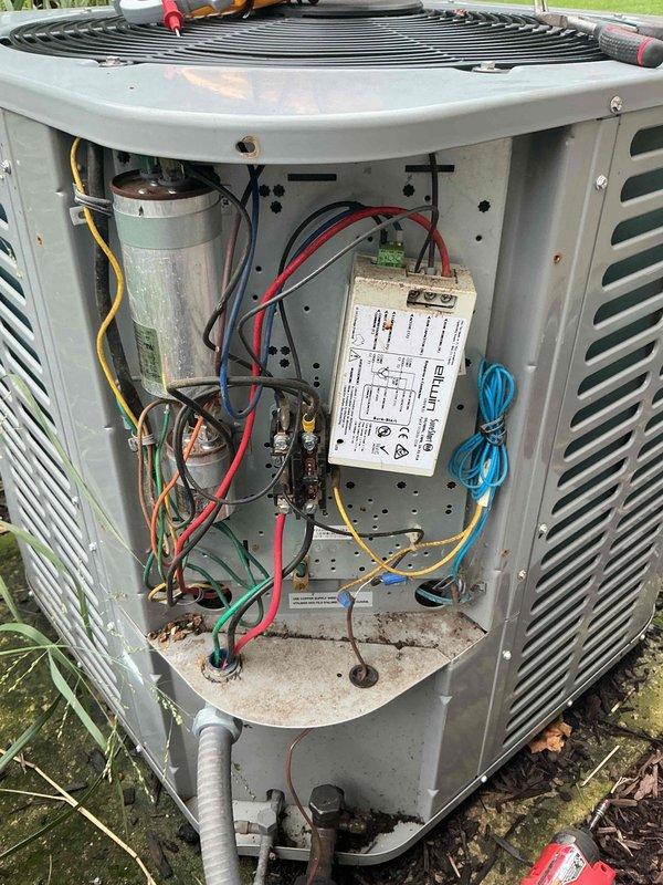 Completed comprehensive tune-up service on 8-year-old Ameristar outdoor condensing unit per scheduled maintenance protocol. Performed visual inspection of unit exterior, noting normal weathering and surface oxidation consistent with age. Removed access panel and inspected internal electrical components including capacitor, contactor, and control module. Observed green corrosion buildup on capacitor surface and general accumulation of dirt and debris within cabinet. Cleaned electrical connections, verified proper wire terminations on all circuits, and tested capacitor functionality. Inspected fan assembly and motor operation, confirmed proper rotation and airflow through top discharge grille. Checked refrigerant pressures and system performance parameters to ensure optimal cooling efficiency.