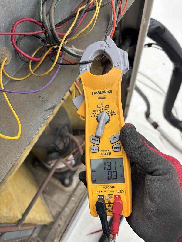 Completed comprehensive BFMA tune-up on 23-year-old commercial rooftop AC unit during scheduled maintenance window. Inspected and tested blower assembly, noting dust accumulation on squirrel cage fan blades; measured electrical parameters using clamp meter showing 13.1A draw, confirming proper amperage within manufacturer specifications. All components operating within normal parameters; system ready for continued service.