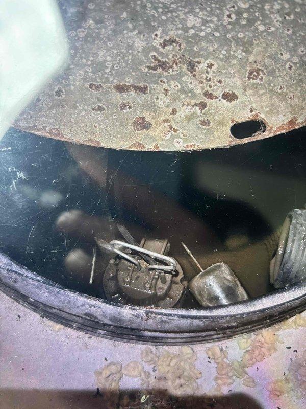 Performed complimentary sump pump inspection at customer's request during mid-day appointment. Upon arrival, accessed sump pit and conducted thorough visual assessment of pump assembly, float mechanism, discharge system, and basin condition. Observed operational pump with standard float switch configuration and chain assembly present. Pit contained standing water at normal operating level with visible sediment accumulation. Basin liner showed typical wear patterns consistent with regular use. Discharge pump components including electrical connections and mounting hardware appeared intact with age-related surface oxidation noted on metallic components. Documented existing conditions through photographic records for customer reference. System components functional at time of inspection with no immediate service requirements identified.