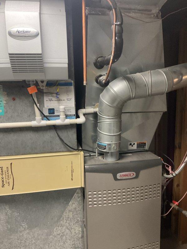 Responded to follow-up service call regarding continued leaking near HVAC system after previous pipe replacement. Upon inspection of the Lennox furnace and associated equipment, identified that the new leak was condensate discharge from the Aprilaire humidifier unit rather than refrigerant line leakage. Verified all copper refrigerant lines and connections were secure with no signs of oil or refrigerant seepage. Traced condensate drainage system and found improper drainage causing water accumulation in the same general area as the previous repair, leading to customer confusion about the leak source. Cleared condensate line obstruction, confirmed proper drainage flow, and verified all HVAC components were operating within normal parameters with no active leaks present at time of departure.