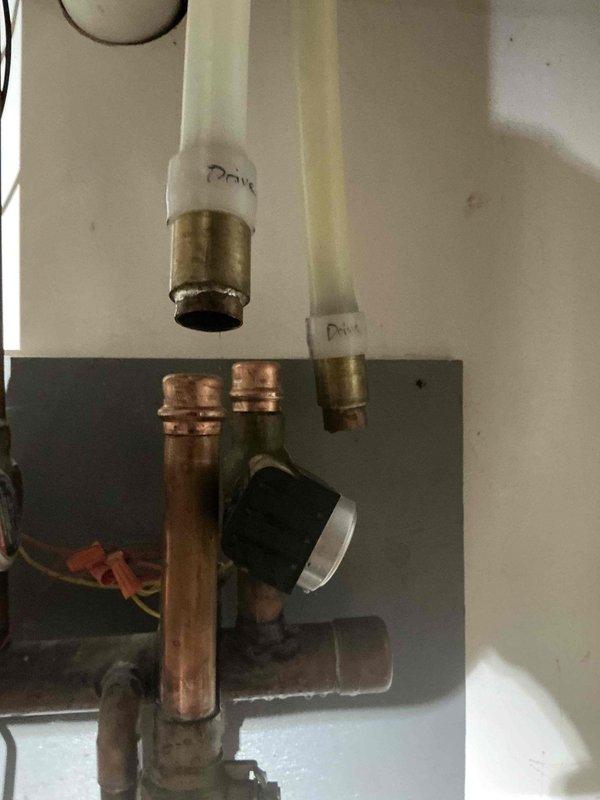Performed boiler service for property undergoing driveway renovation with existing snowmelt system. Capped off snowmelt zone to accommodate contractor's excavation work and driveway replacement. Inspected existing boiler plumbing assembly including multiple zone valves, pressure gauges, heat exchanger connections, and copper piping with press fittings installed by previous contractor.