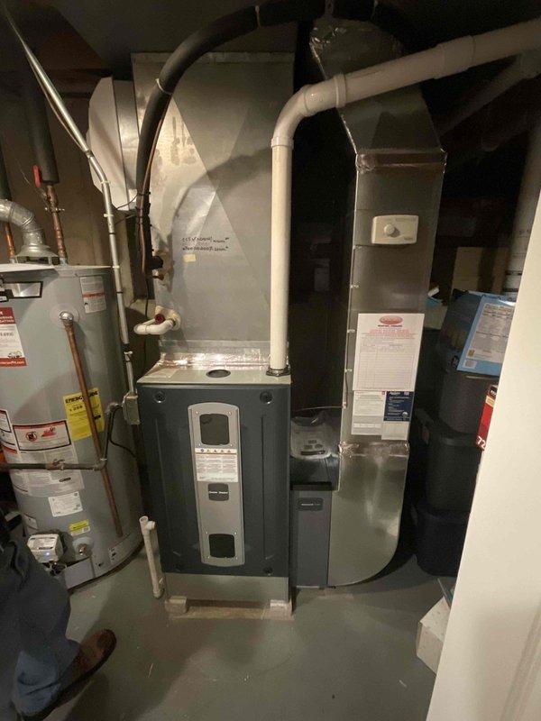 Conducted site evaluation for backdraft issues affecting fireplace and multiple appliances. Assessed existing HVAC system including furnace, air handler, and outdoor condensing unit to determine feasibility of Energy Recovery Ventilator (ERV) installation to resolve negative pressure conditions and improve indoor air quality.