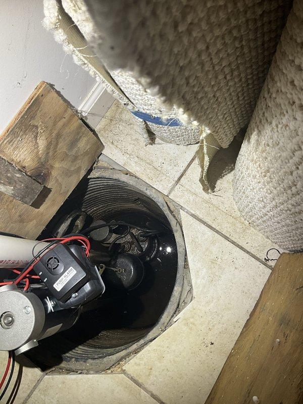 Responded to service call for non-functioning sump pump system. Upon arrival, inspected sump pump basin and found pump unit inoperative. Evaluated electrical connections, control boxes, and discharge piping configuration. Pump motor had failed and was no longer cycling to remove water from the pit. Replaced defective sump pump with new unit, verified proper float switch operation, and tested discharge through existing PVC pipe system. Confirmed electrical connections at wall-mounted control boxes were secure and functioning correctly. System tested successfully with water introduced into basin, pump activated as designed and discharged water through vertical piping. Left system operational and ready for automatic operation.