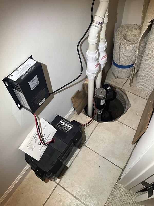 Responded to service call for non-functioning sump pump system. Upon arrival, inspected sump pump basin and found pump unit inoperative. Evaluated electrical connections, control boxes, and discharge piping configuration. Pump motor had failed and was no longer cycling to remove water from the pit. Replaced defective sump pump with new unit, verified proper float switch operation, and tested discharge through existing PVC pipe system. Confirmed electrical connections at wall-mounted control boxes were secure and functioning correctly. System tested successfully with water introduced into basin, pump activated as designed and discharged water through vertical piping. Left system operational and ready for automatic operation.