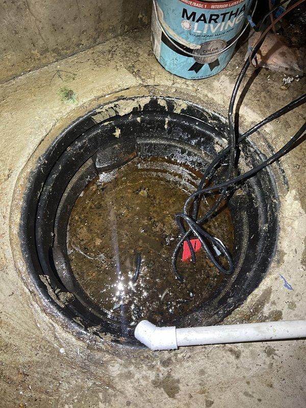 Removed and disposed of existing primary sump pump and backup battery system from basement location. Installed new primary sump pump with corrugated basin liner in existing concrete pit, ensuring proper positioning and secure mounting of pump mechanism. Connected new backup battery system with charger unit, routing all electrical connections to existing outlet box on basement wall. Installed and secured white PVC discharge piping vertically along wall to carry water away from foundation. Tested both primary and backup pump operation to verify proper function and water discharge. All equipment covered under 3-year warranty for pumps and charger, with 1-year warranty on battery and labor.