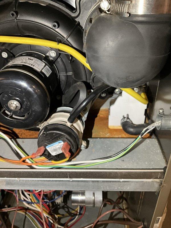 Completed comprehensive BFMA tune-up service on 13+ year old air conditioning system, including inspection of blower motor assembly, electrical connections, and ductwork components. Verified proper operation of Honeywell digital thermostat with current temperature reading of 72°F and setpoint of 66°F. All system components inspected and confirmed operational with no immediate repairs required.