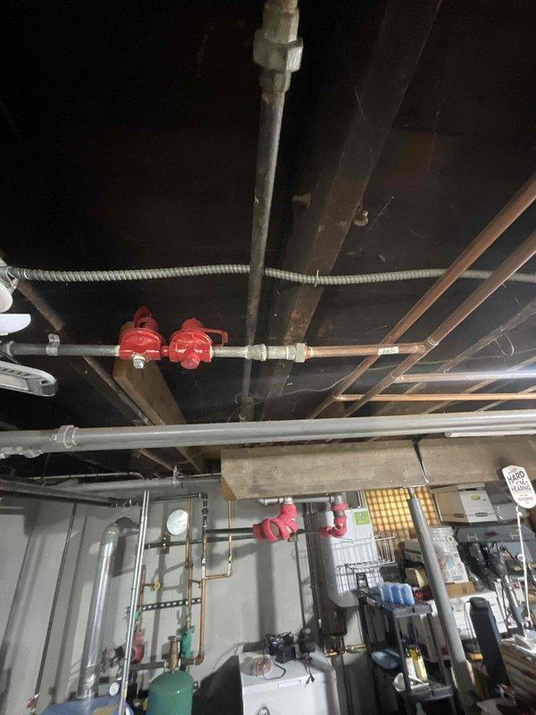 Responded to no heat call on 28-year-old Buderus boiler system. Upon inspection, identified active leakage at the pressure relief safety valve and output line connections. Documented system conditions with photos showing compromised valve integrity and wet piping. Additionally addressed Mitsubishi mini-split system with two upstairs indoor units experiencing intermittent operation, alternating between functioning and non-functioning states. Inspected electrical connections, refrigerant lines, and control wiring to both heads to diagnose communication or power supply issues causing the cycling behavior.
